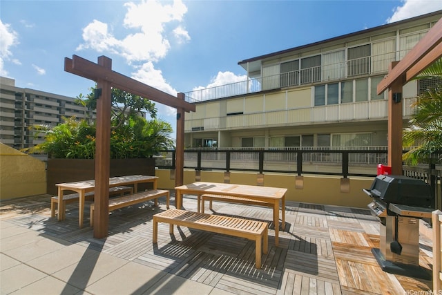 1717 Mott Smith Dr Unit 707, Honolulu, HI 96822 - view of patio featuring grilling area and outdoor dining area