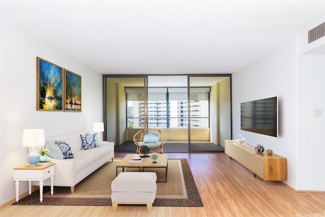 1717 Mott Smith Dr Unit 707, Honolulu, HI 96822 - living area featuring wood finished floors