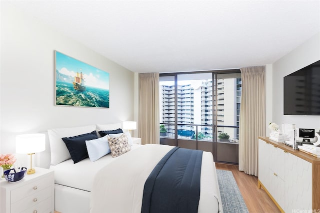 1717 Mott Smith Dr Unit 707, Honolulu, HI 96822 - bedroom featuring light wood-style flooring