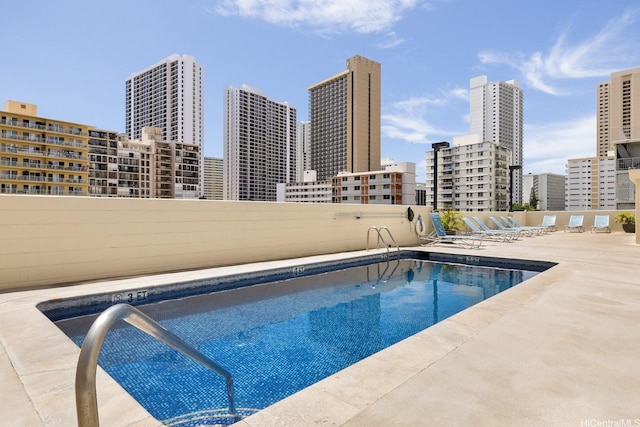 2452 Tusitala St Unit 1207, Honolulu, HI 96815 - community pool featuring a skyline view