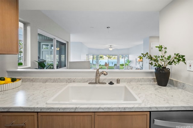 7007 Hawaii Kai Dr Unit A16, Honolulu, HI 96825 - kitchen with a sink, dishwasher, ceiling fan, and brown cabinets