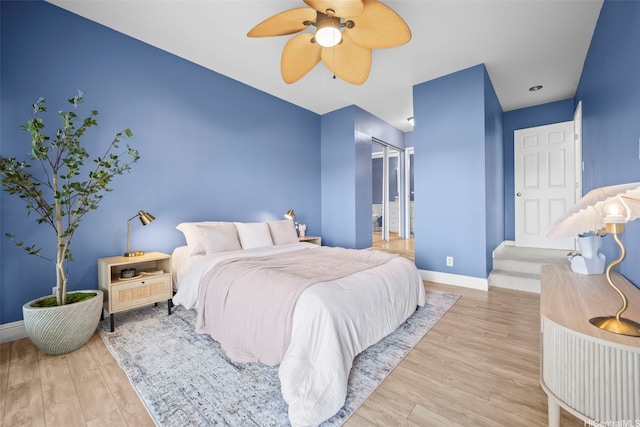 7007 Hawaii Kai Dr Unit A16, Honolulu, HI 96825 - bedroom with wood finished floors, baseboards, and ceiling fan
