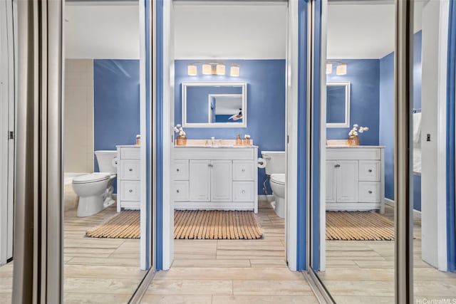 7007 Hawaii Kai Dr Unit A16, Honolulu, HI 96825 - bathroom featuring toilet, wood tiled floors, and vanity
