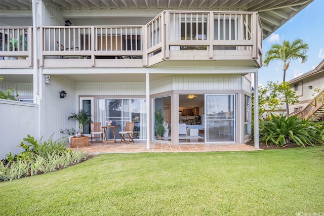 7007 Hawaii Kai Dr Unit A16, Honolulu, HI 96825 - back of property with a balcony, a patio area, and a lawn