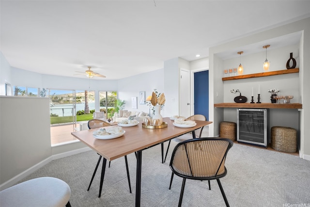 7007 Hawaii Kai Dr Unit A16, Honolulu, HI 96825 - carpeted dining space featuring wine cooler, a bar, baseboards, a ceiling fan, and recessed lighting