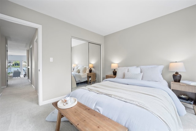 7007 Hawaii Kai Dr Unit A16, Honolulu, HI 96825 - bedroom with light carpet, baseboards, and a closet