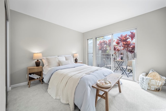 7007 Hawaii Kai Dr Unit A16, Honolulu, HI 96825 - bedroom featuring access to outside, light colored carpet, and baseboards