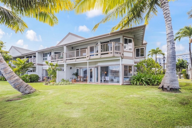 7007 Hawaii Kai Dr Unit A16, Honolulu, HI 96825 - back of house with a balcony and a lawn
