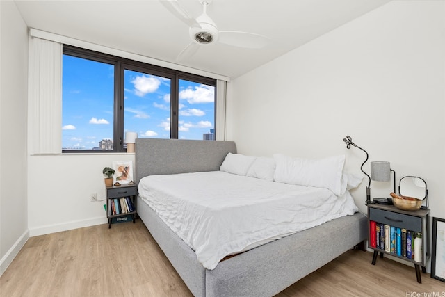 600 Queen St Unit 607, Honolulu, HI 96813 - bedroom with wood finished floors, baseboards, and multiple windows