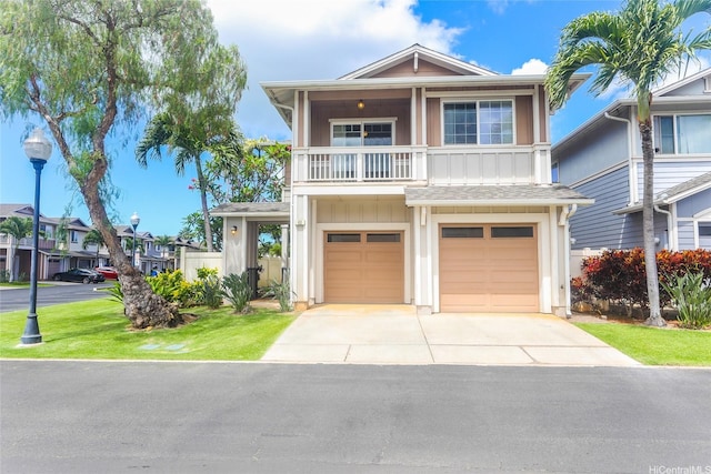 91-1200 Keaunui Dr Unit 400, Ewa Beach, HI 96706 - view of front of home featuring concrete driveway, a balcony, a garage, and board and batten siding