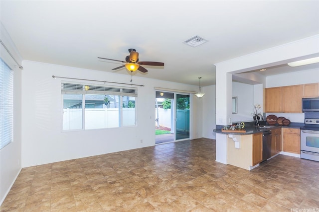 91-1200 Keaunui Dr Unit 400, Ewa Beach, HI 96706 - kitchen featuring stainless steel appliances, a sink, dark countertops, ceiling fan, and open floor plan