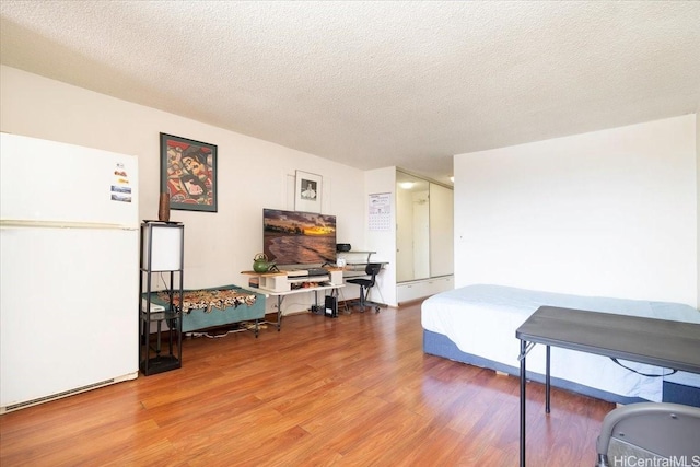 747 Amana St Unit 1405, Honolulu, HI 96814 - living area with wood finished floors and a textured ceiling
