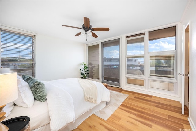 94-391 Kaholo St Unit 88, Mililani, HI 96789 - bedroom featuring light wood-type flooring, access to outside, and a ceiling fan