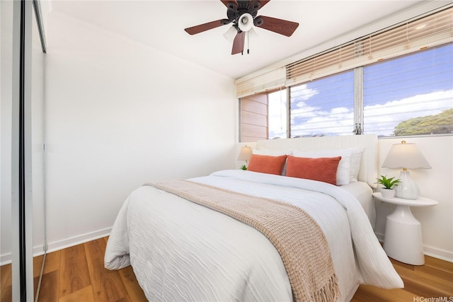 94-391 Kaholo St Unit 88, Mililani, HI 96789 - bedroom with wood finished floors and ceiling fan