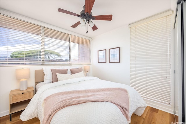 94-391 Kaholo St Unit 88, Mililani, HI 96789 - bedroom featuring wood finished floors and a ceiling fan