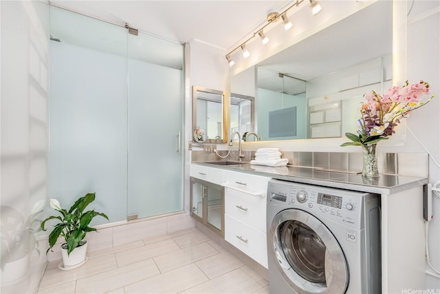 2500 Kalakaua Ave Unit 504, Honolulu, HI 96815 - washroom featuring washer / dryer, light tile patterned flooring, and rail lighting