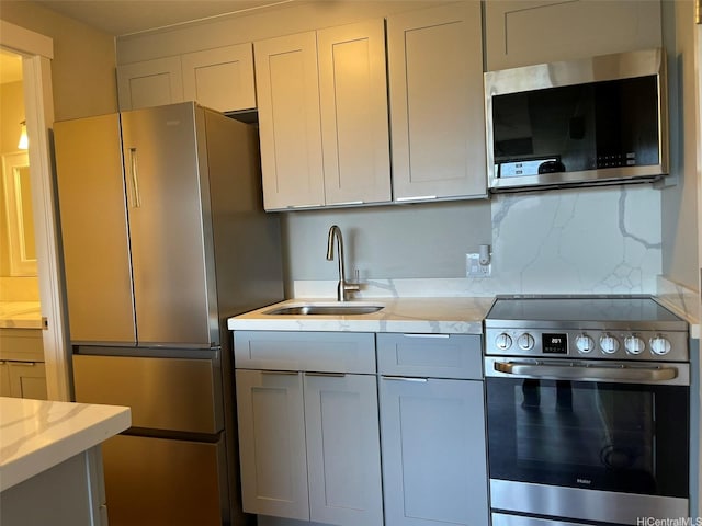 2888 Ala Ilima St Unit 910, Honolulu, HI 96818 - kitchen with stainless steel appliances, a sink, and light stone counters