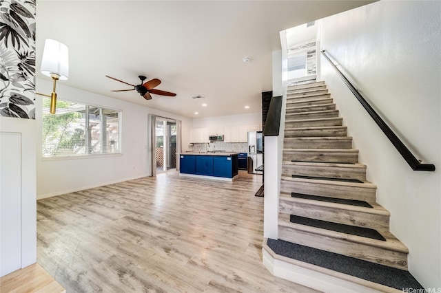91-6221 Kapolei Pkwy Unit 334, Ewa Beach, HI 96706 - staircase featuring a ceiling fan, wood finished floors, recessed lighting, and baseboards