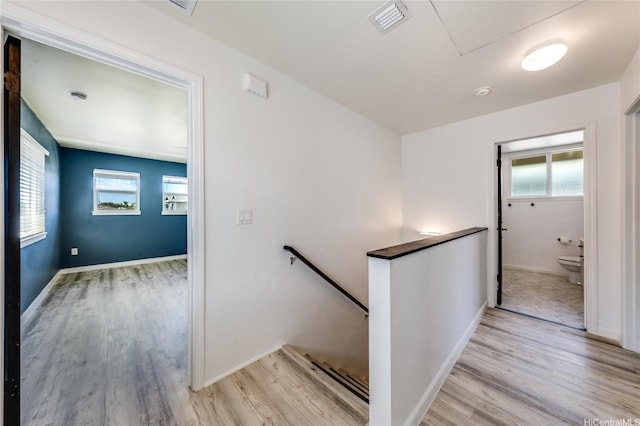 91-6221 Kapolei Pkwy Unit 334, Ewa Beach, HI 96706 - stairway with wood finished floors, plenty of natural light, and baseboards