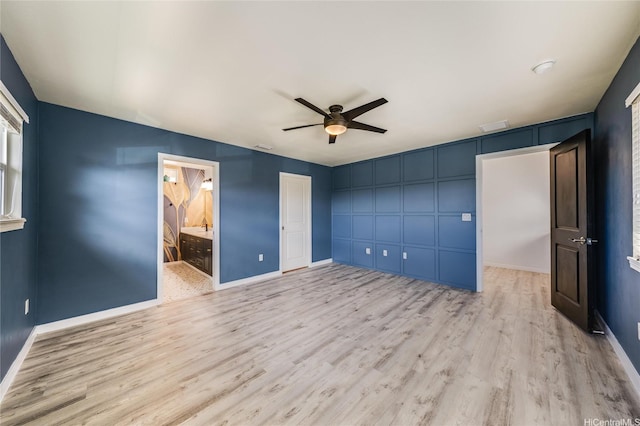 91-6221 Kapolei Pkwy Unit 334, Ewa Beach, HI 96706 - unfurnished bedroom featuring light wood-style flooring, a decorative wall, baseboards, ceiling fan, and a closet