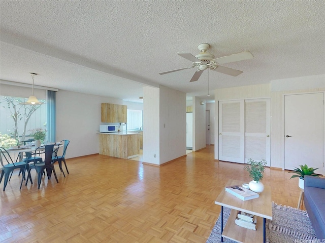94-1036 Leomana Pl, Waipahu, HI 96797 - living room with a textured ceiling and ceiling fan
