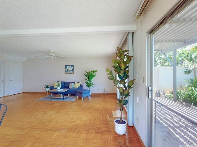 94-1036 Leomana Pl, Waipahu, HI 96797 - living room featuring beamed ceiling, ceiling fan, baseboards, and a textured ceiling