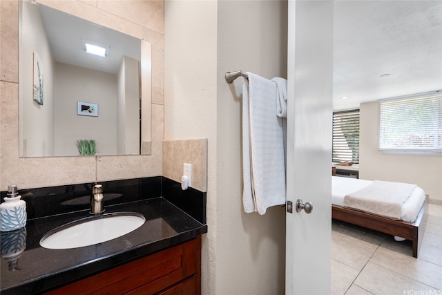 57-91 Lalo Kuilima Pl Unit 5/47, Kahuku, HI 96731 - ensuite bathroom featuring vanity, tile patterned floors, and tasteful backsplash