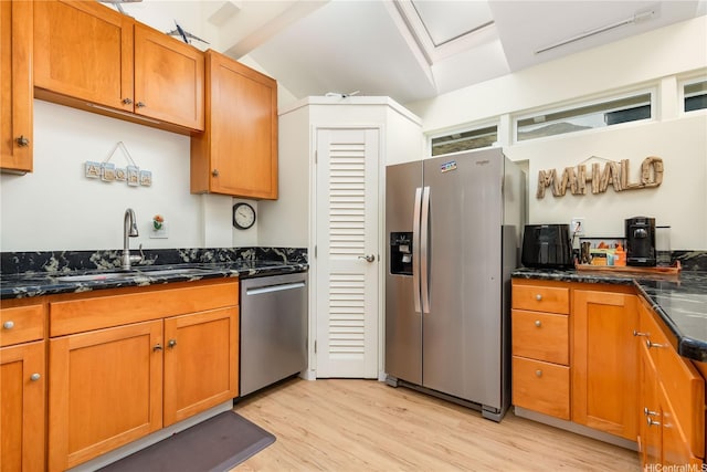 1441 Honokahua St, Honolulu, HI 96825 - kitchen featuring stainless steel appliances, a sink, light wood finished floors, lofted ceiling, and brown cabinets
