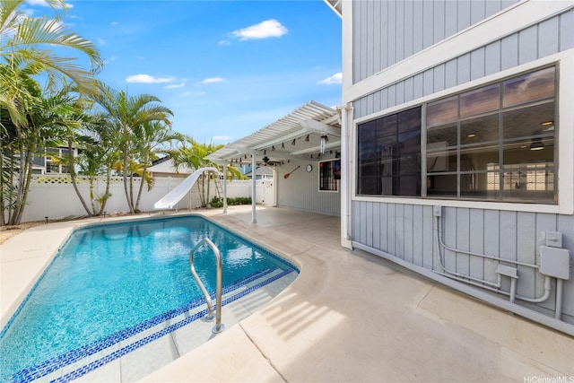 91-1011 Aeoia St Unit A, Ewa Beach, HI 96706 - view of swimming pool featuring a water slide, a pergola, a patio, and a fenced backyard