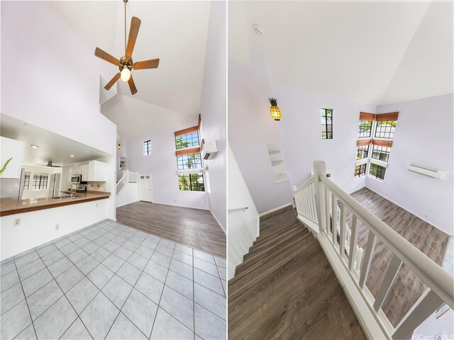 91-1011 Aeoia St Unit A, Ewa Beach, HI 96706 - staircase featuring high vaulted ceiling, plenty of natural light, ceiling fan, and wood finished floors