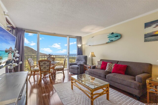 84-740 Kili Dr Unit G1626, Waianae, HI 96792 - living area featuring a textured ceiling, floor to ceiling windows, hardwood / wood-style flooring, and ornamental molding