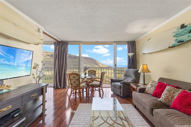 84-740 Kili Dr Unit G1626, Waianae, HI 96792 - living area featuring a wall of windows, a mountain view, ornamental molding, a textured ceiling, and dark wood-style floors