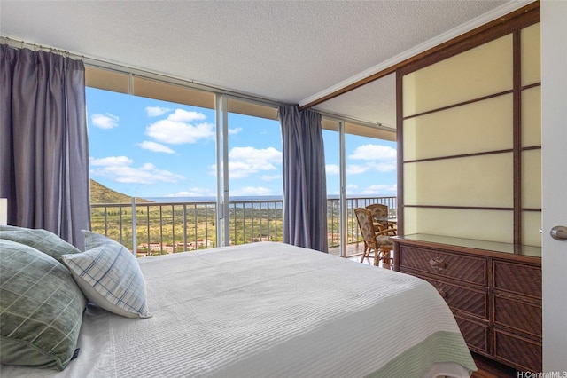 84-740 Kili Dr Unit G1626, Waianae, HI 96792 - bedroom featuring access to outside, a textured ceiling, and floor to ceiling windows