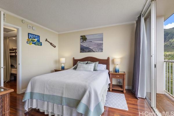 84-740 Kili Dr Unit G1626, Waianae, HI 96792 - bedroom featuring crown molding, wood finished floors, and baseboards