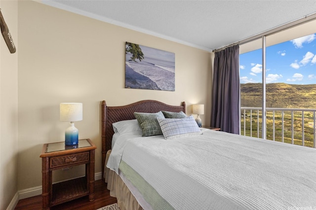 84-740 Kili Dr Unit G1626, Waianae, HI 96792 - bedroom with wood finished floors, ornamental molding, baseboards, and a wall of windows