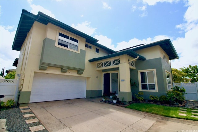 91-1066 Lanakoi St, Kapolei, HI 96707 - view of front of property with stucco siding, an attached garage, and concrete driveway