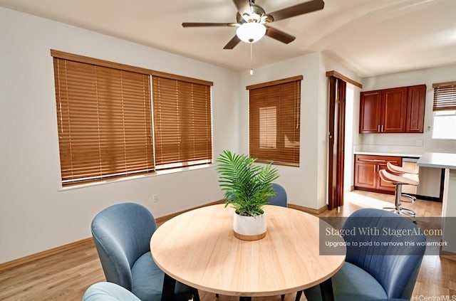 91-1066 Lanakoi St, Kapolei, HI 96707 - dining area featuring light wood finished floors, a ceiling fan, baseboards, and an office area