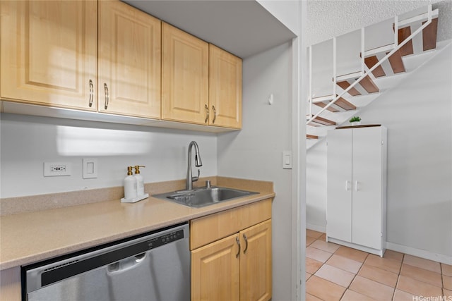 3030 Pualei Cir Unit 311, Honolulu, HI 96815 - kitchen featuring stainless steel dishwasher, a sink, light brown cabinets, light countertops, and light tile patterned flooring