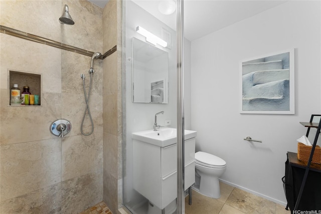 3030 Pualei Cir Unit 311, Honolulu, HI 96815 - bathroom featuring vanity, a tile shower, toilet, and baseboards