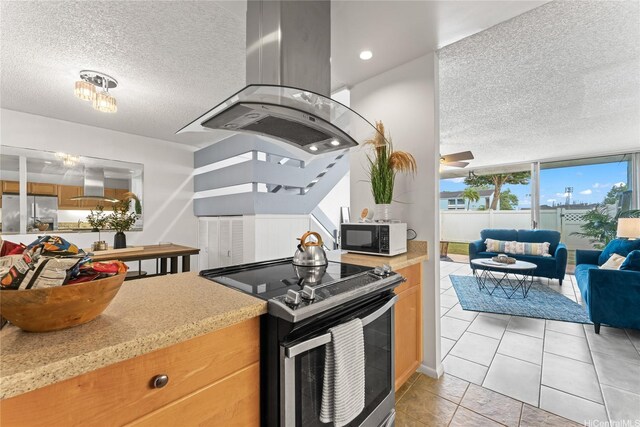 95-112 Kipapa Dr Unit 418, Mililani, HI 96789 - kitchen featuring appliances with stainless steel finishes, island range hood, a textured ceiling, ventilation hood, and light countertops