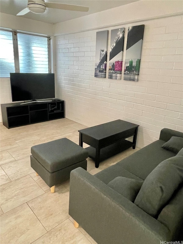 410 Nahua St Unit 106, Honolulu, HI 96815 - living room featuring brick wall and a ceiling fan