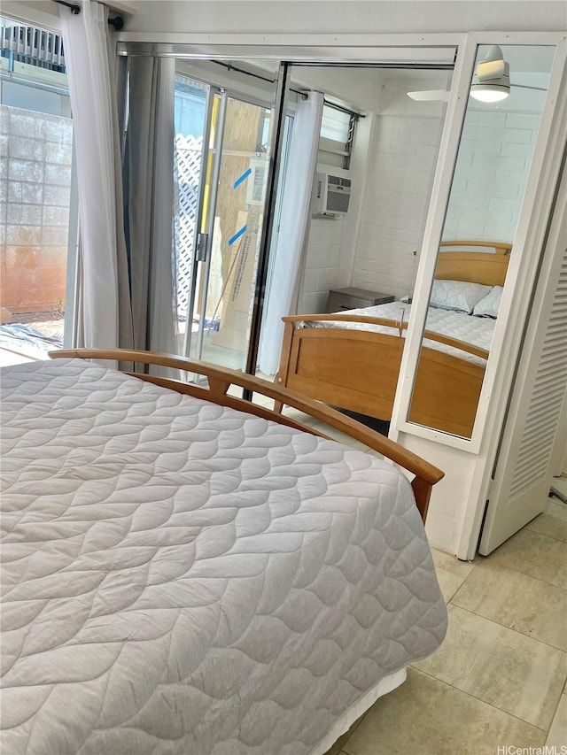 410 Nahua St Unit 106, Honolulu, HI 96815 - bedroom featuring access to outside, light tile patterned floors, and cooling unit