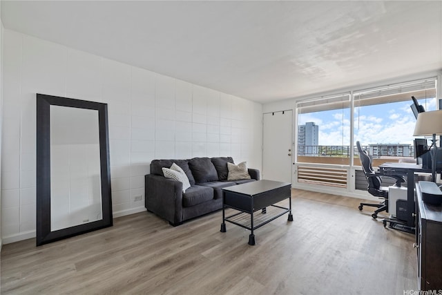 1710 Makiki St Unit 1005, Honolulu, HI 96822 - living area with light wood-style floors, an office area, and tile walls