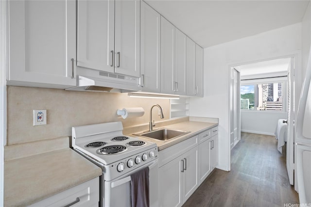 1710 Makiki St Unit 1005, Honolulu, HI 96822 - kitchen with under cabinet range hood, white range with electric cooktop, a sink, wood finished floors, and white cabinets