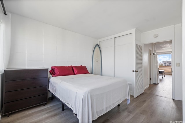 1710 Makiki St Unit 1005, Honolulu, HI 96822 - bedroom with wood finished floors and a closet