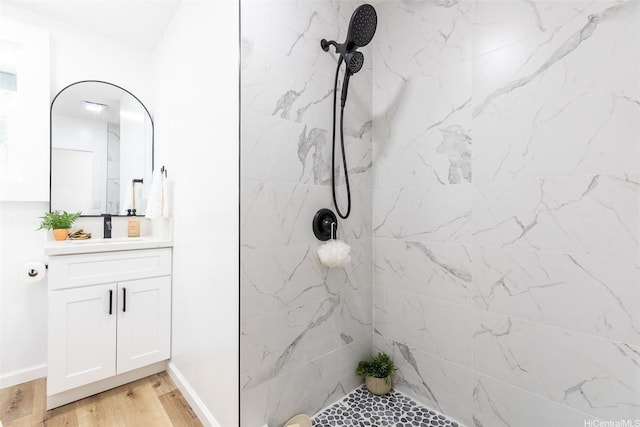 91-1327 Imelda St, Ewa Beach, HI 96706 - full bath featuring vanity, a tile shower, wood finished floors, and baseboards