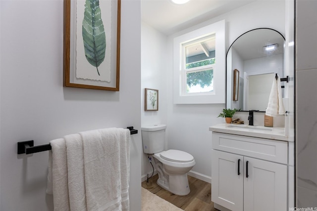 91-1327 Imelda St, Ewa Beach, HI 96706 - half bathroom with vanity, wood finished floors, toilet, and baseboards