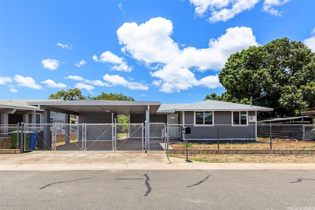 91-1327 Imelda St, Ewa Beach, HI 96706 - view of front of property with a gate, a fenced front yard, driveway, and a carport