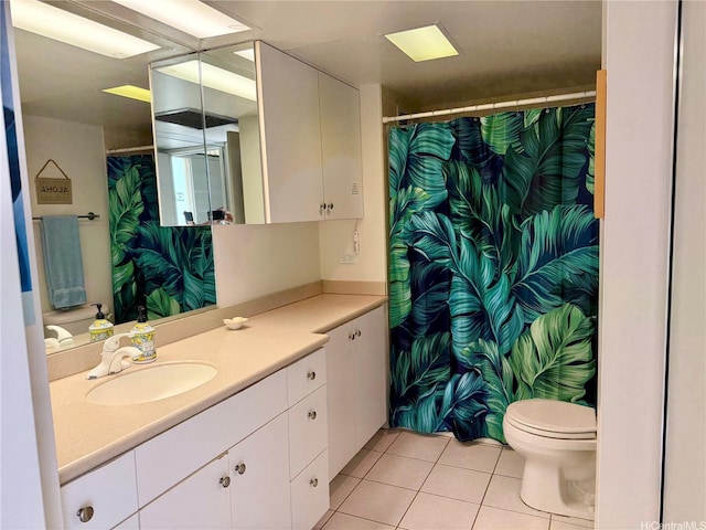 84-680 Kili Dr Unit 1001, Waianae, HI 96792 - bathroom featuring tile patterned floors, toilet, vanity, and a shower with shower curtain