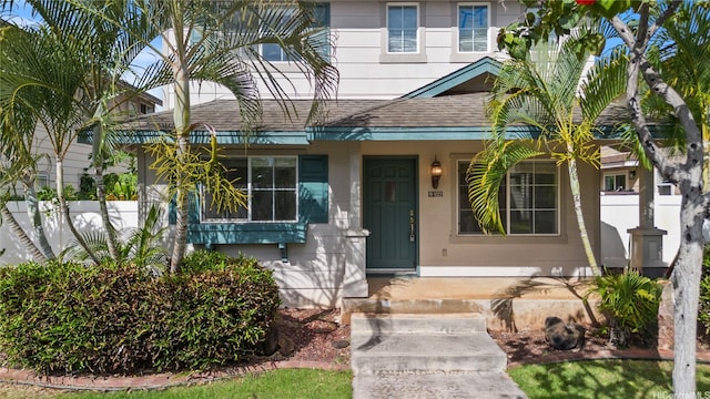 91-1022 Kaikauhaa St, Ewa Beach, HI 96706 - view of front of home featuring a shingled roof and a porch